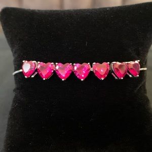 Rhodium over sterling silver lab ruby heart bolo bracelet